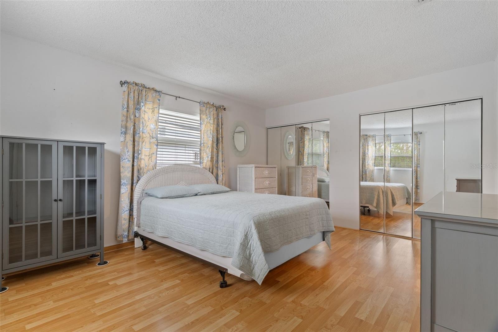 Bedroom with Laminate Floors and Double Closets