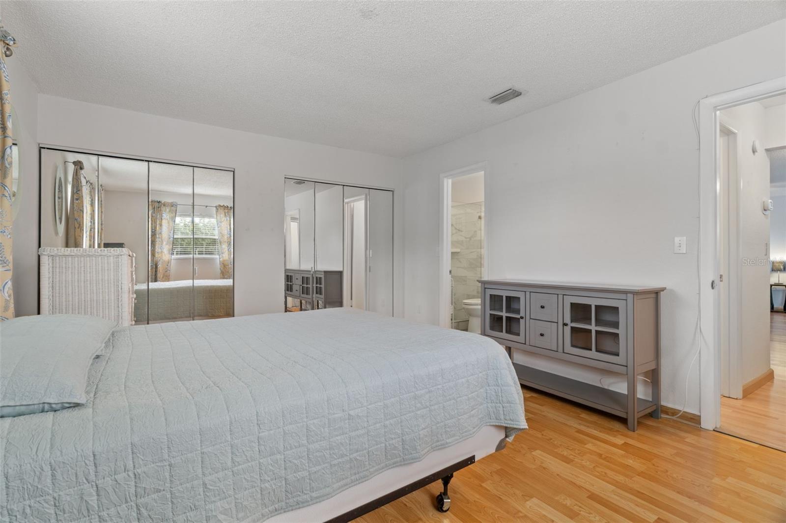 Bedroom with Laminate Floors and Double Closets