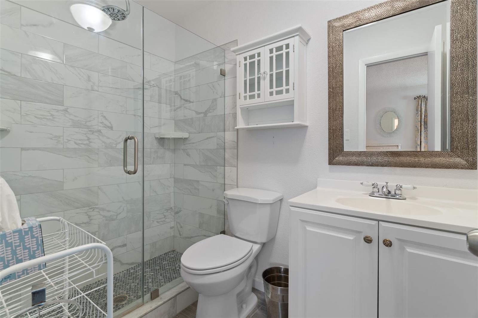 Updated En-Suite Bath with Glass Doors