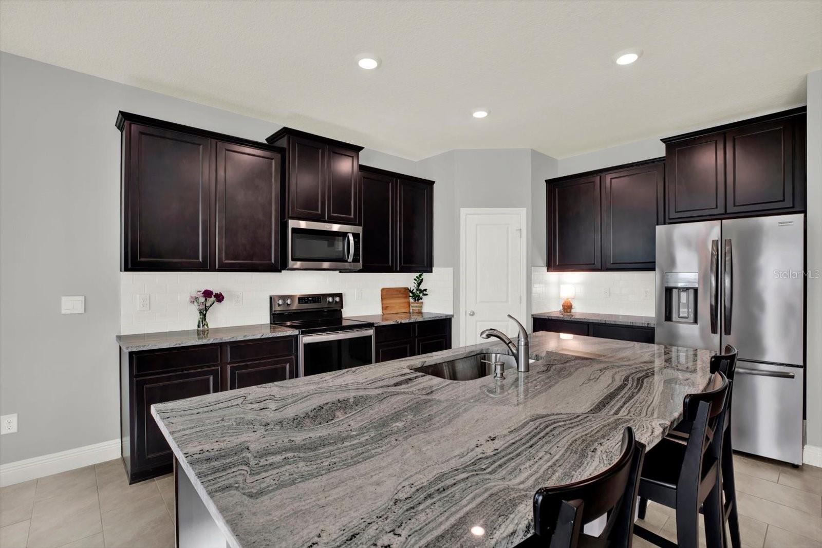 Gorgeous granite counters in kitchen and throughout the home