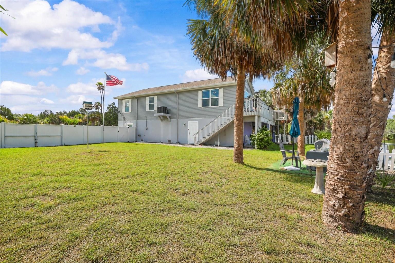 Side Yard with plenty of room for a Pool, Fire Pit, Summer Kitchen..