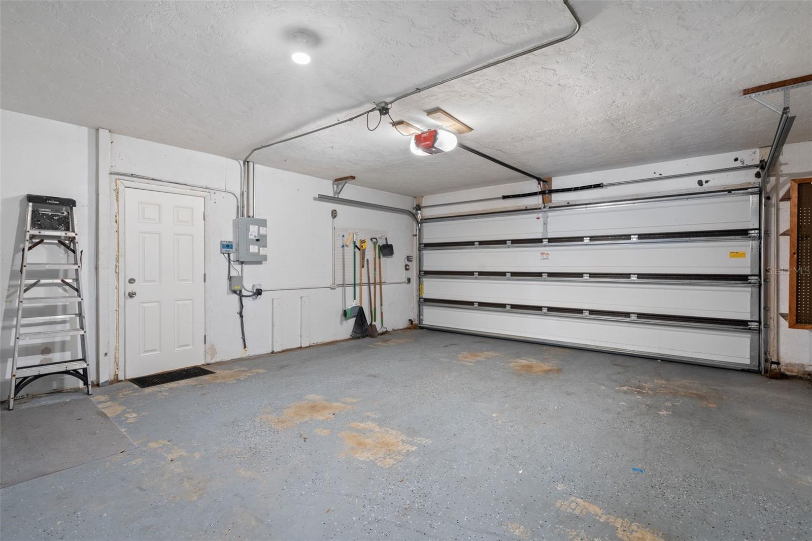 Door to yard from 2 car garage