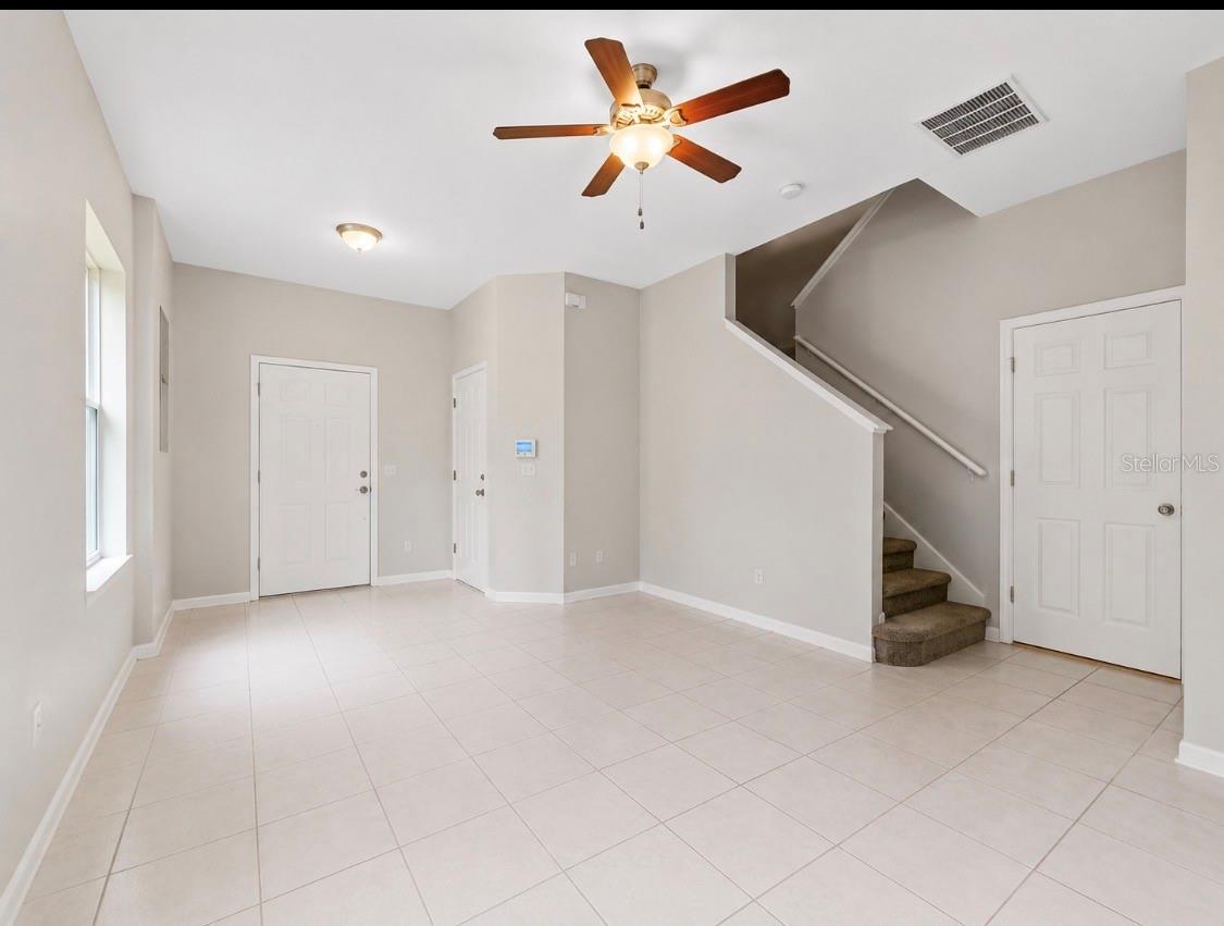 again looking back on the living room the half bath is right at the bottom of the stairs