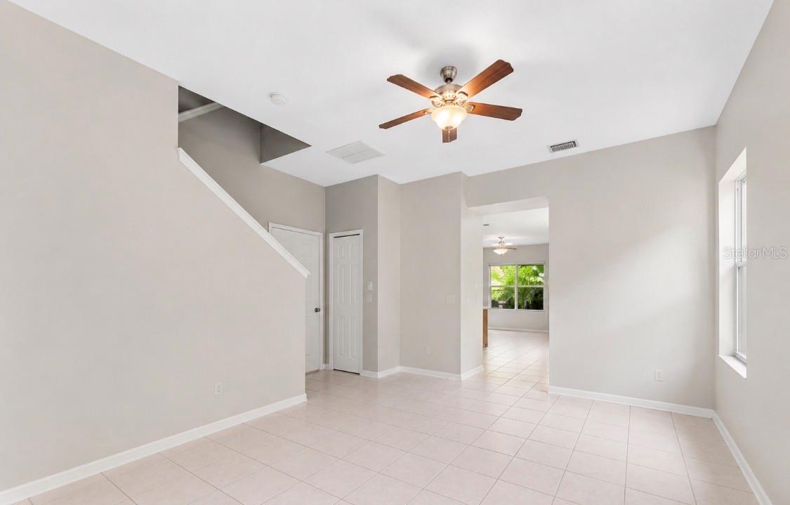 living room upon entry the doorway goes into kitchen with family and dining room