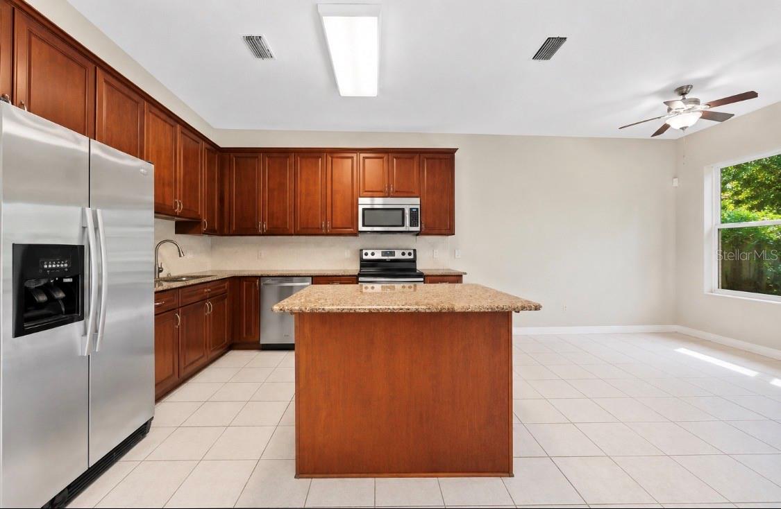 kitchen showing the area for either the dining room or family room