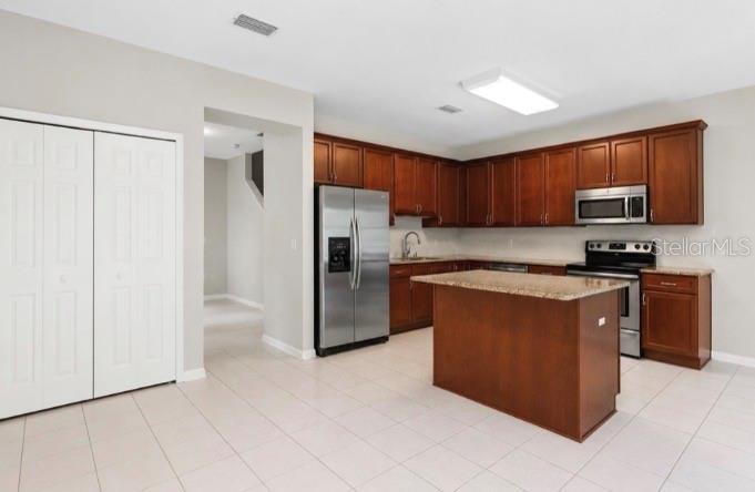 kitchen from by the sliders to the lanai this area can be dining room or family room the closet can be the pantry in my opinion