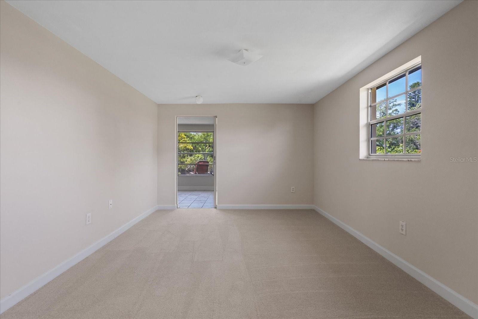 Primary bedroom with door to Lanai