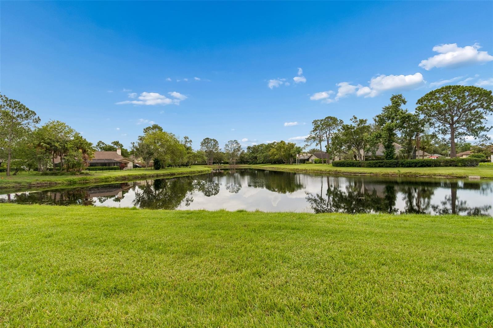 Peaceful pond views create the perfect backdrop for everyday living