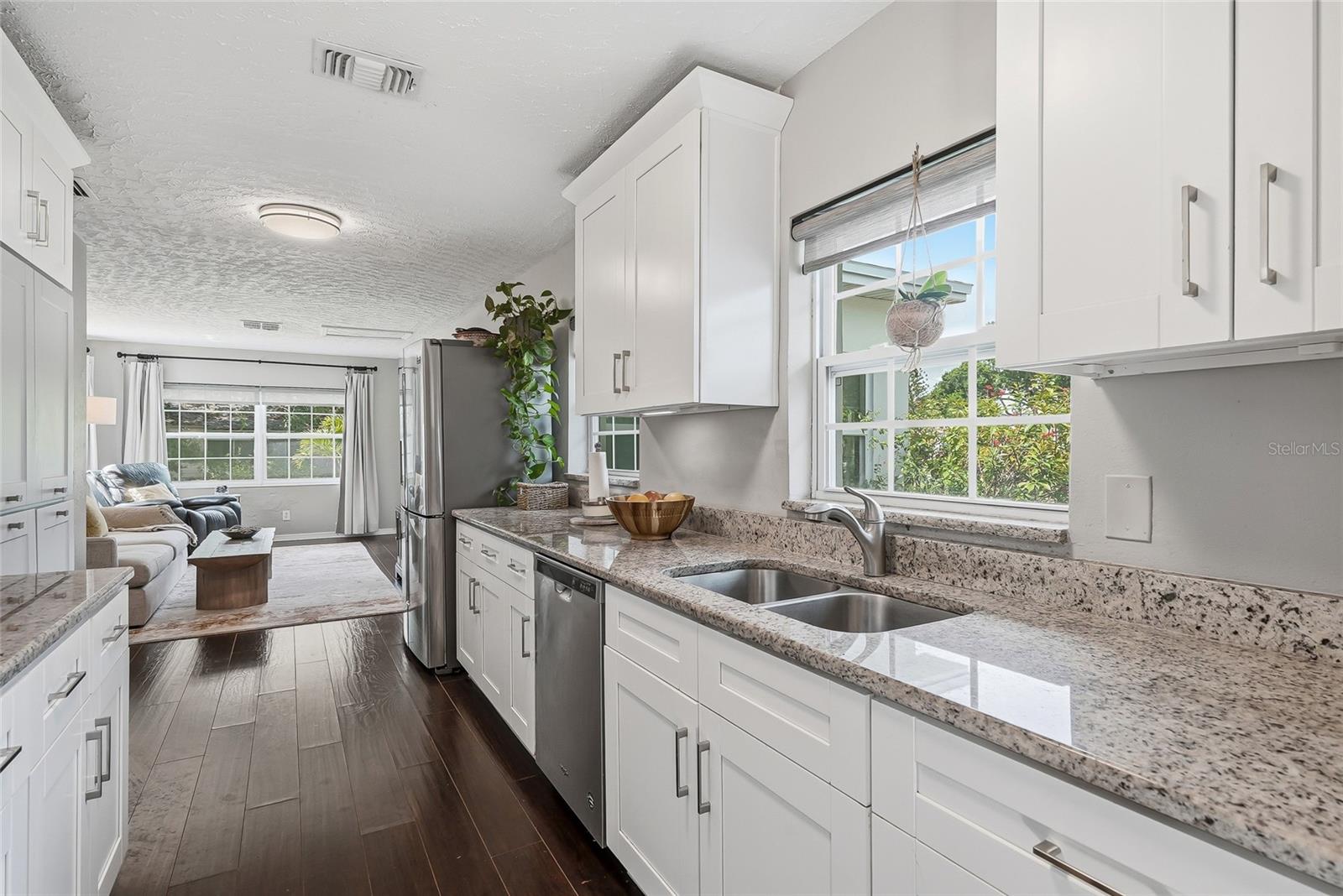 Kitchen is centrally located and anchors the home.