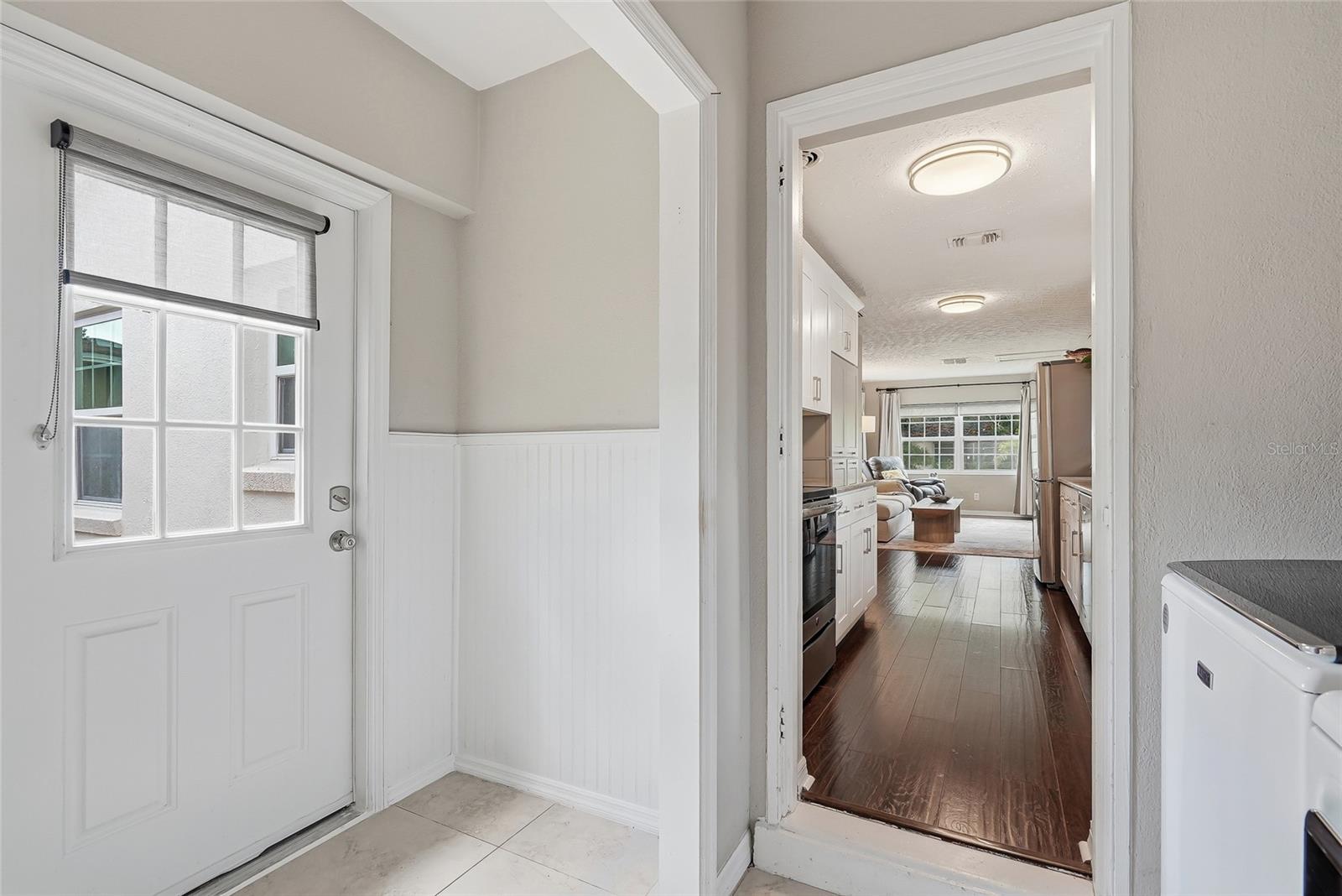 Laundry room features a door to the beautiful deck space.