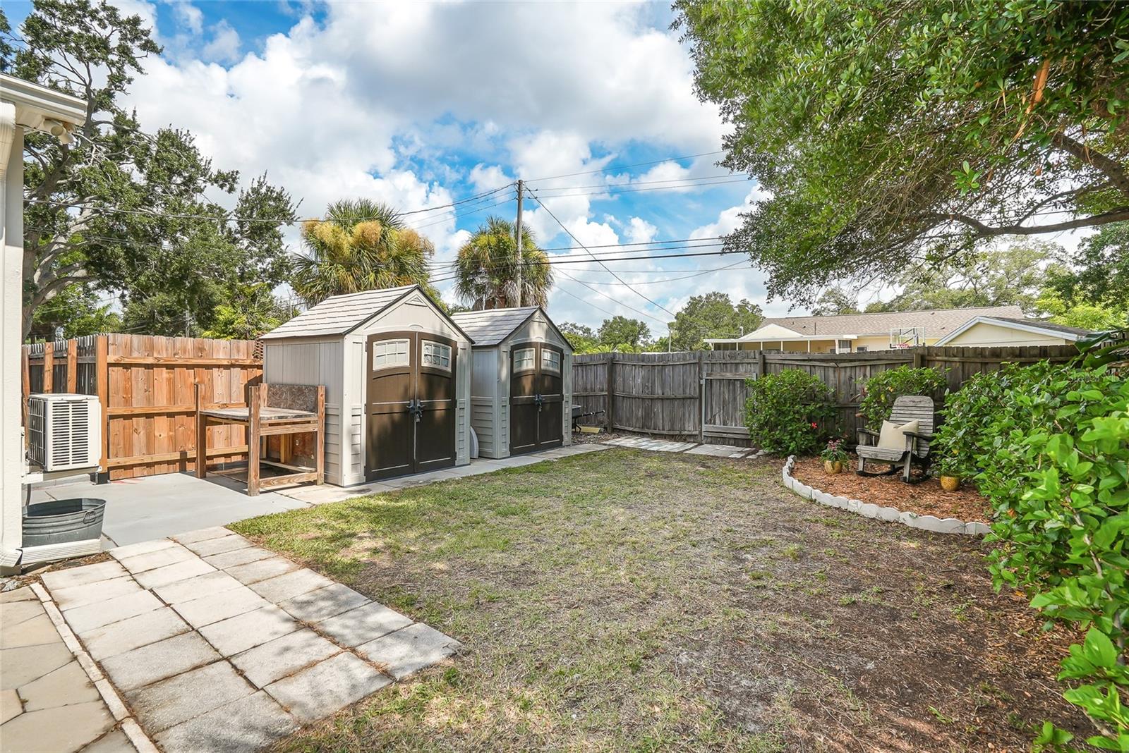 Plenty of space to play and many storage sheds for extra space.
