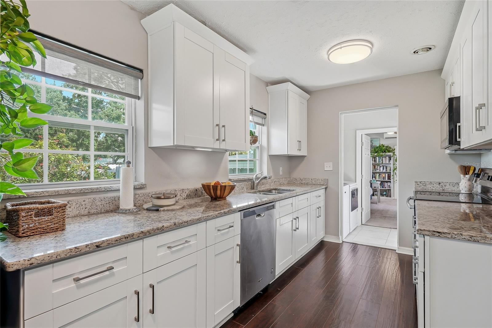 Large galley-style kitchen with fabulous countertop space and cabinetry.
