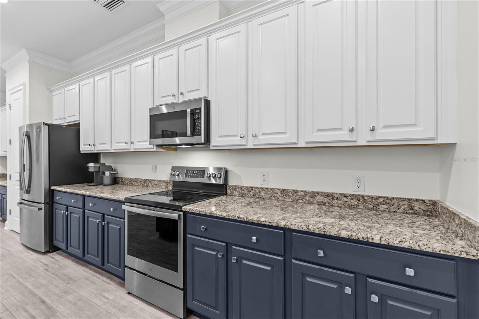 So many cabinets and plenty of counter space for multiple hands in the kitchen.