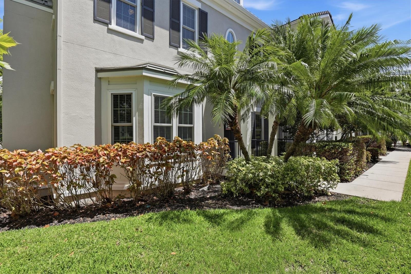 Tropical landscaping is maintained by the HOA.