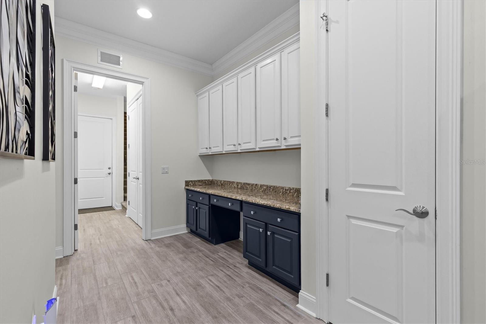 Butler's Pantry with built-in task desk and even more cabinets. 2nd pantry closet.