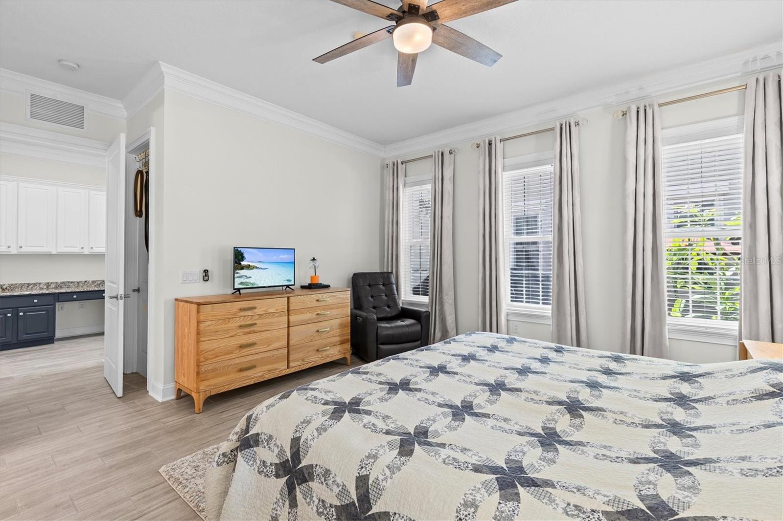 Dual walk-in closets flank the entrance to the primary suite.