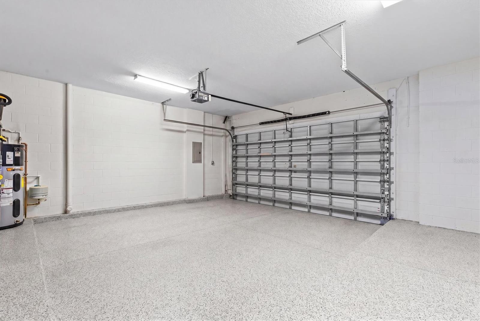 Oversized 2 car garage is meticulously maintained and features premium floor finish. Newer hot water heater and water conditioning system.
