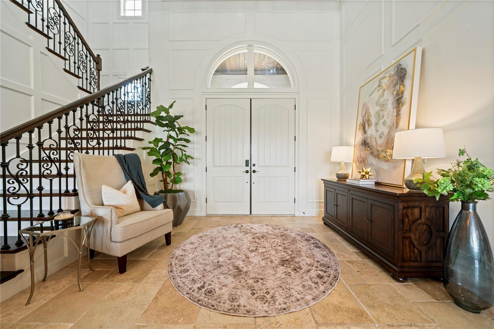 Inviting foyer with double door entry.