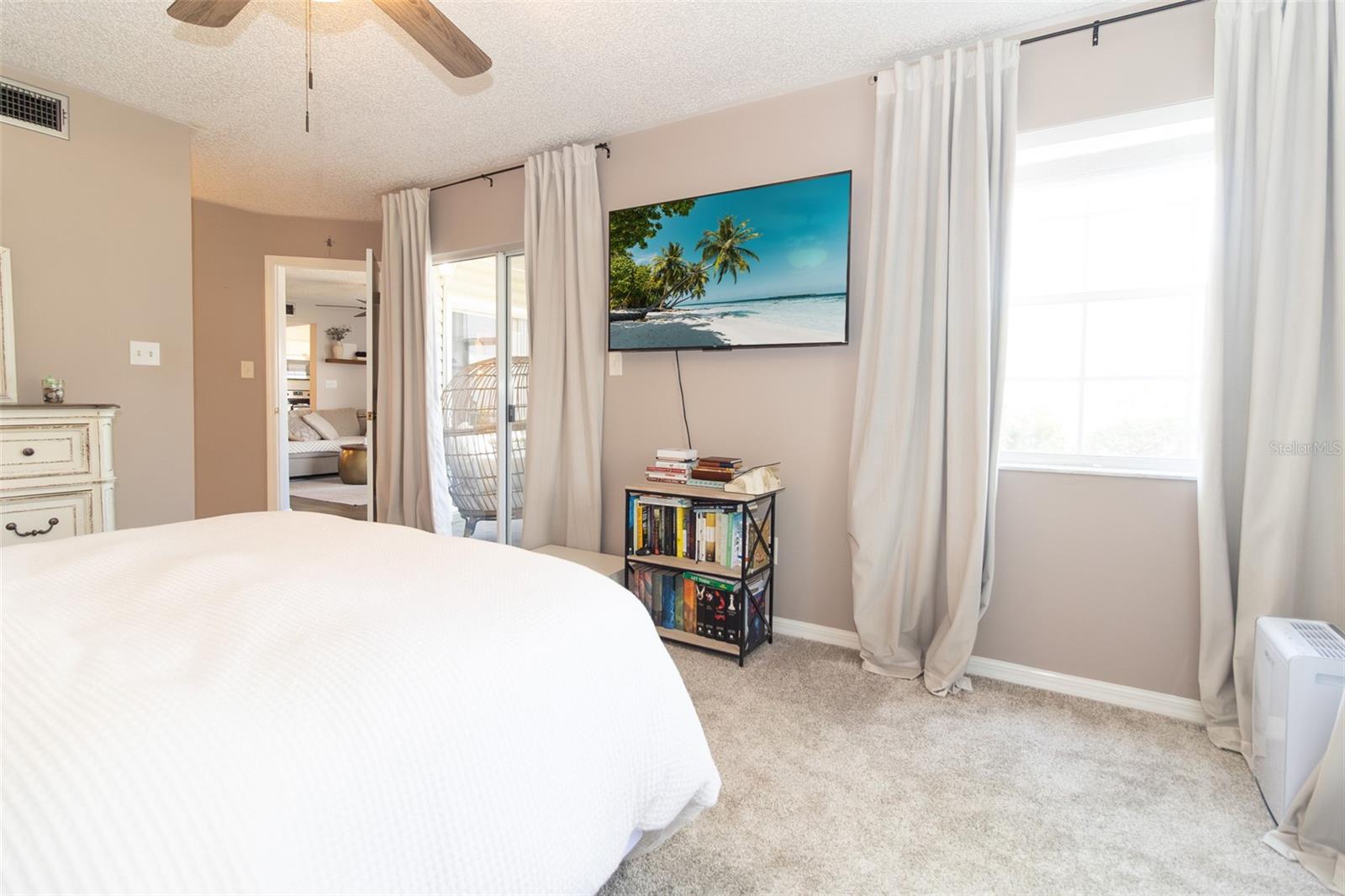 Enter your patio through sliding glass doors from your master suite