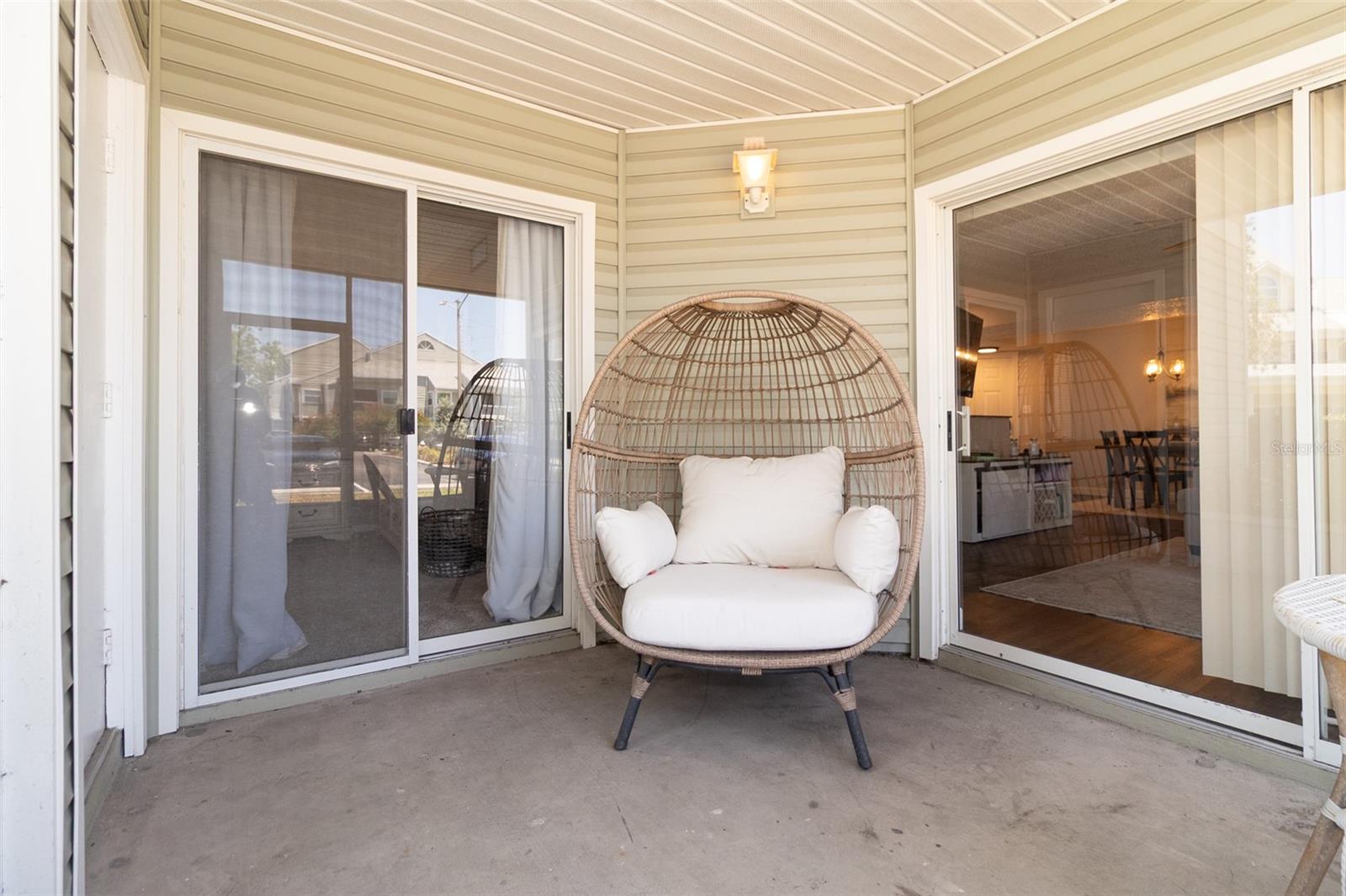large screened patio with storage closet