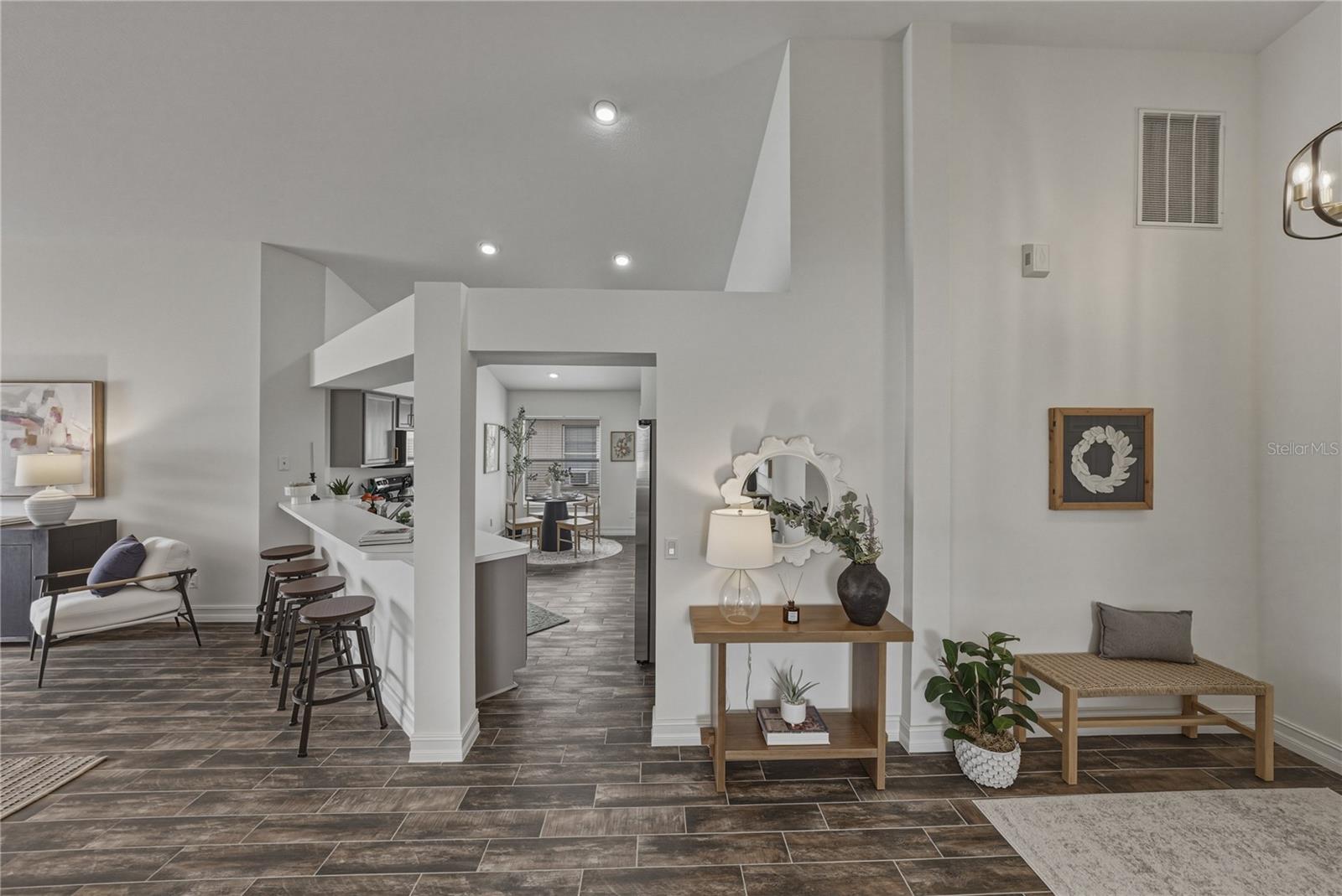 Open Kitchen to Family Room with Vaulted Ceilings