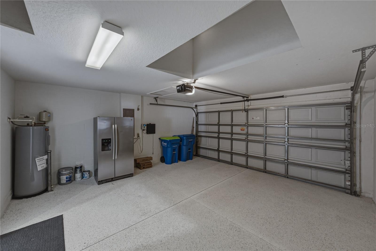 Garage with Extra Garage Refrigerator and Epoxy Floors
