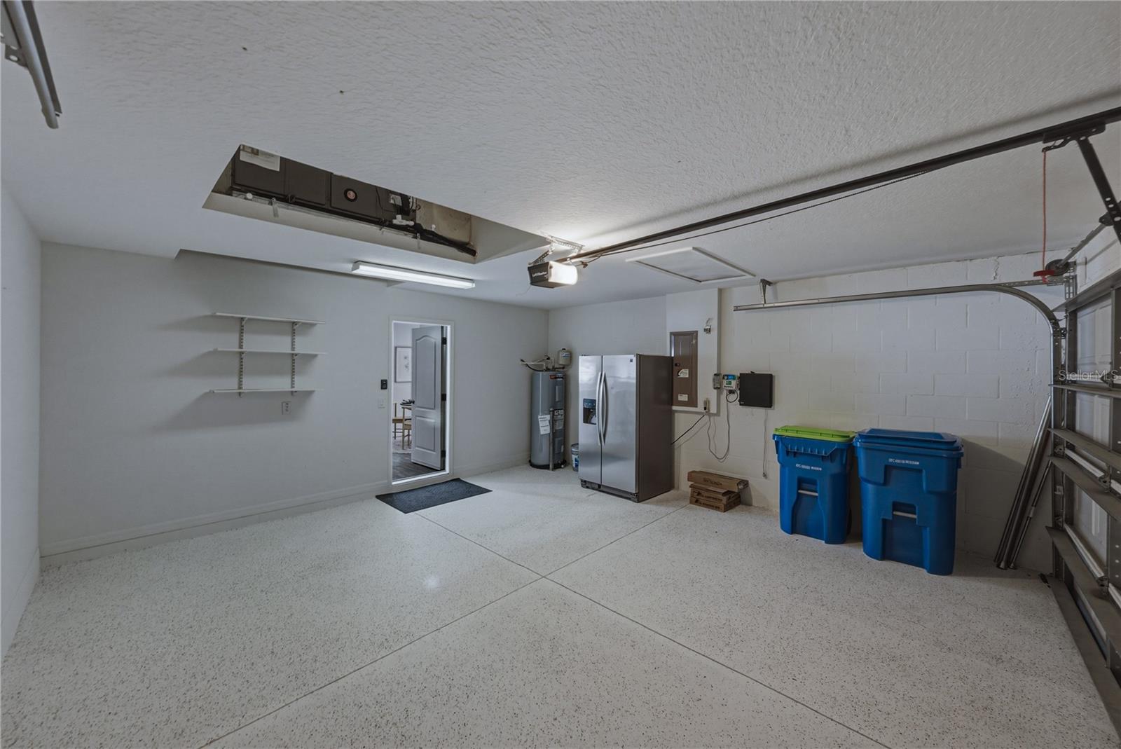 Garage with Extra Garage Refrigerator and Epoxy Floors