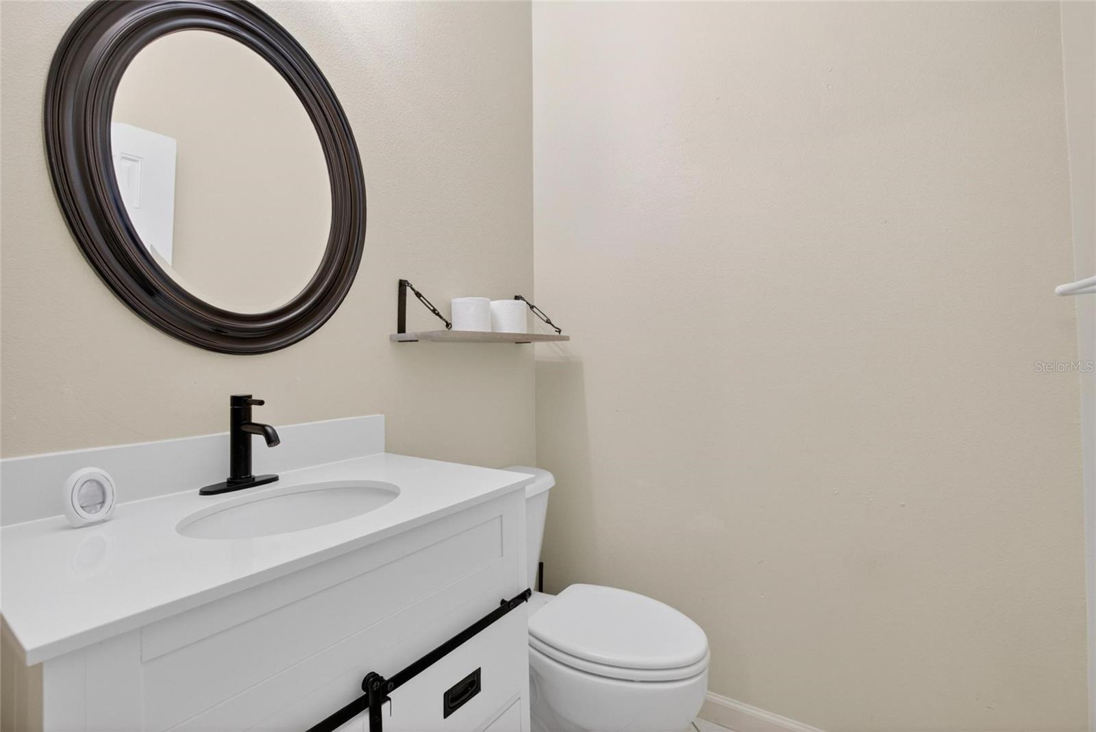 Upstairs half bath.