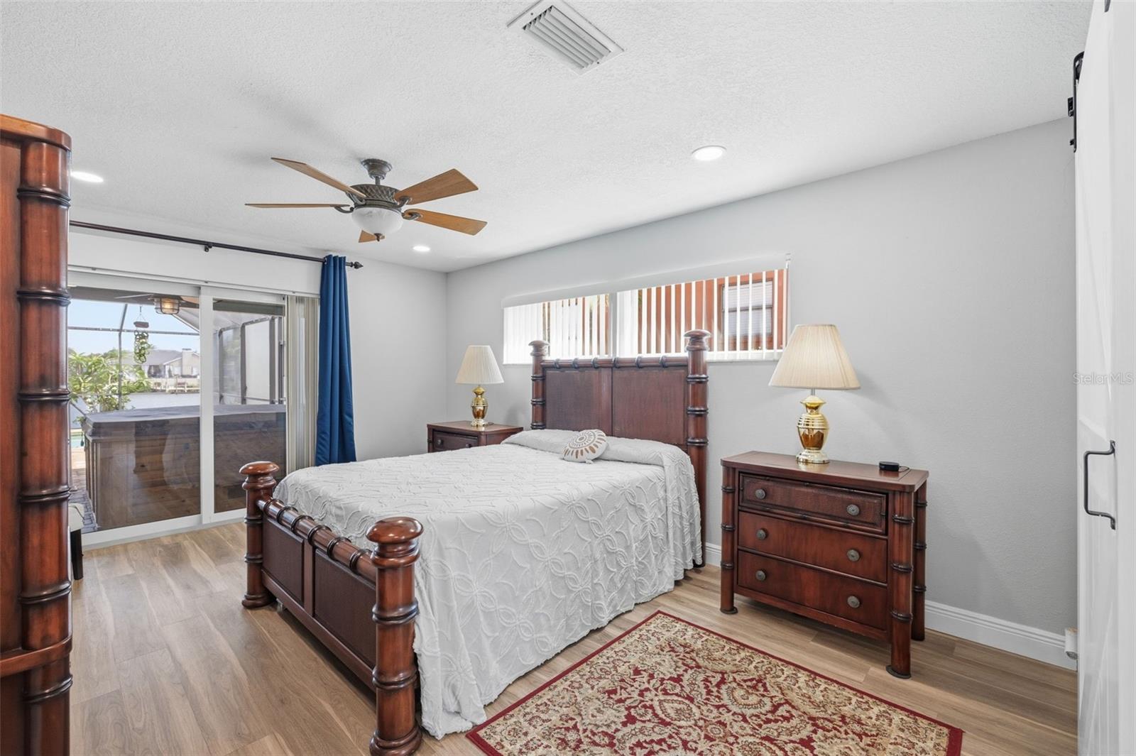 Primary Bedroom with Pocketing Impact Energy Efficient Slider! Uplifting feeling with the natural light that you will enjoy!
