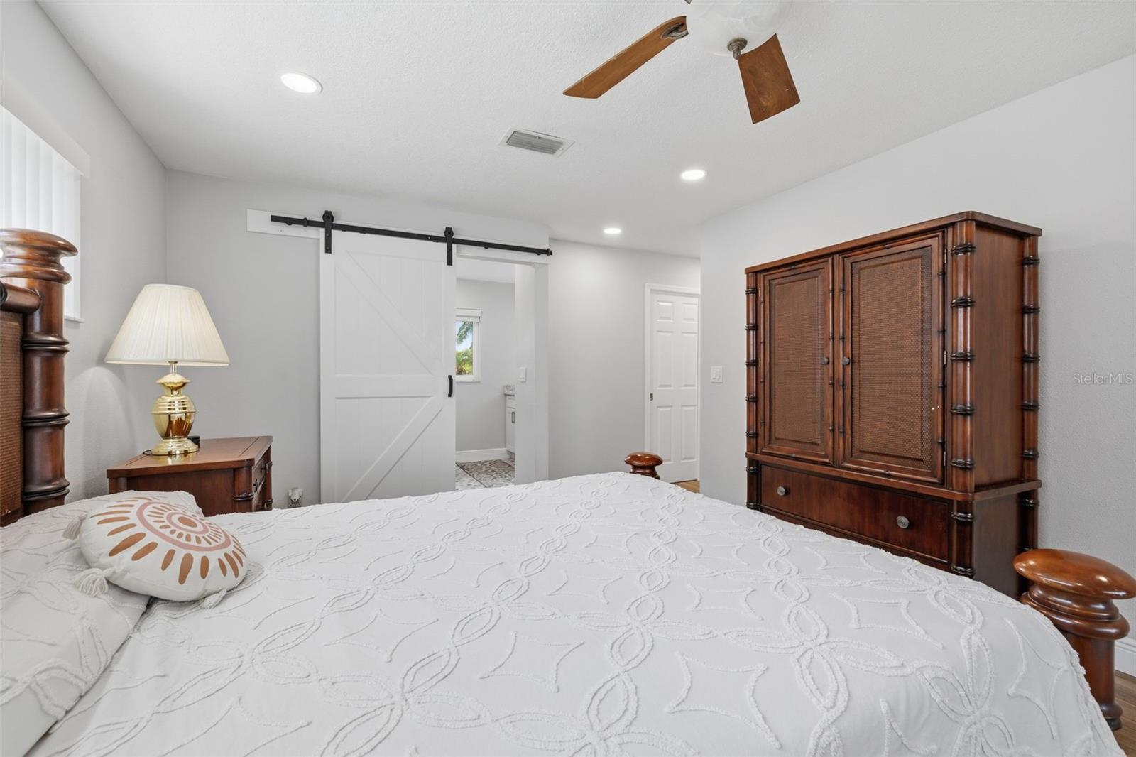 Primary Bedroom with Extra LED Can Lights! En Suite Bathroom has Barn Door and Master Closet is a Pocket Door!