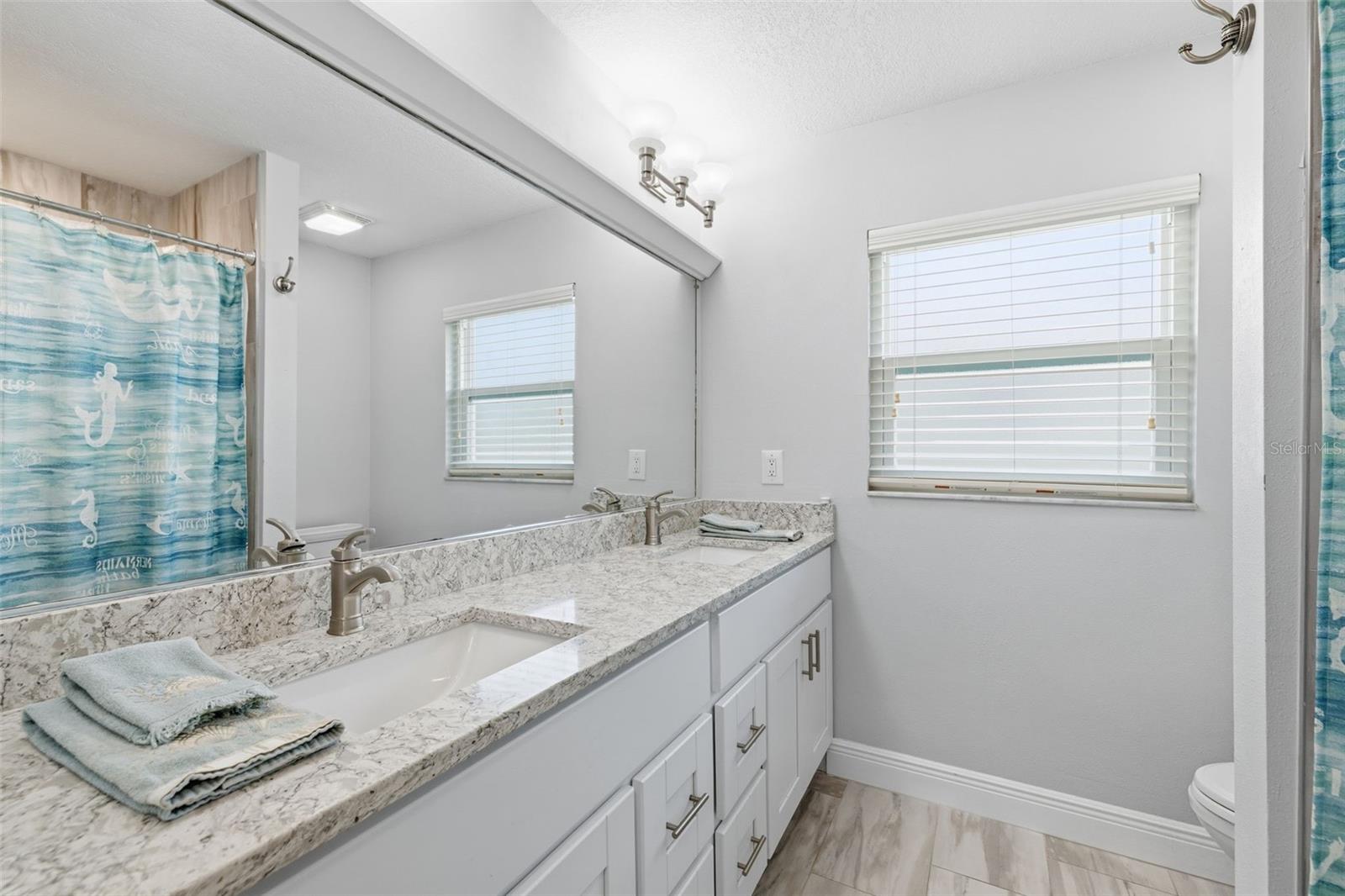 Guest Bathroom with Quartz Counters! Dual Sinks! plenty of Drawers and Cabinetry!