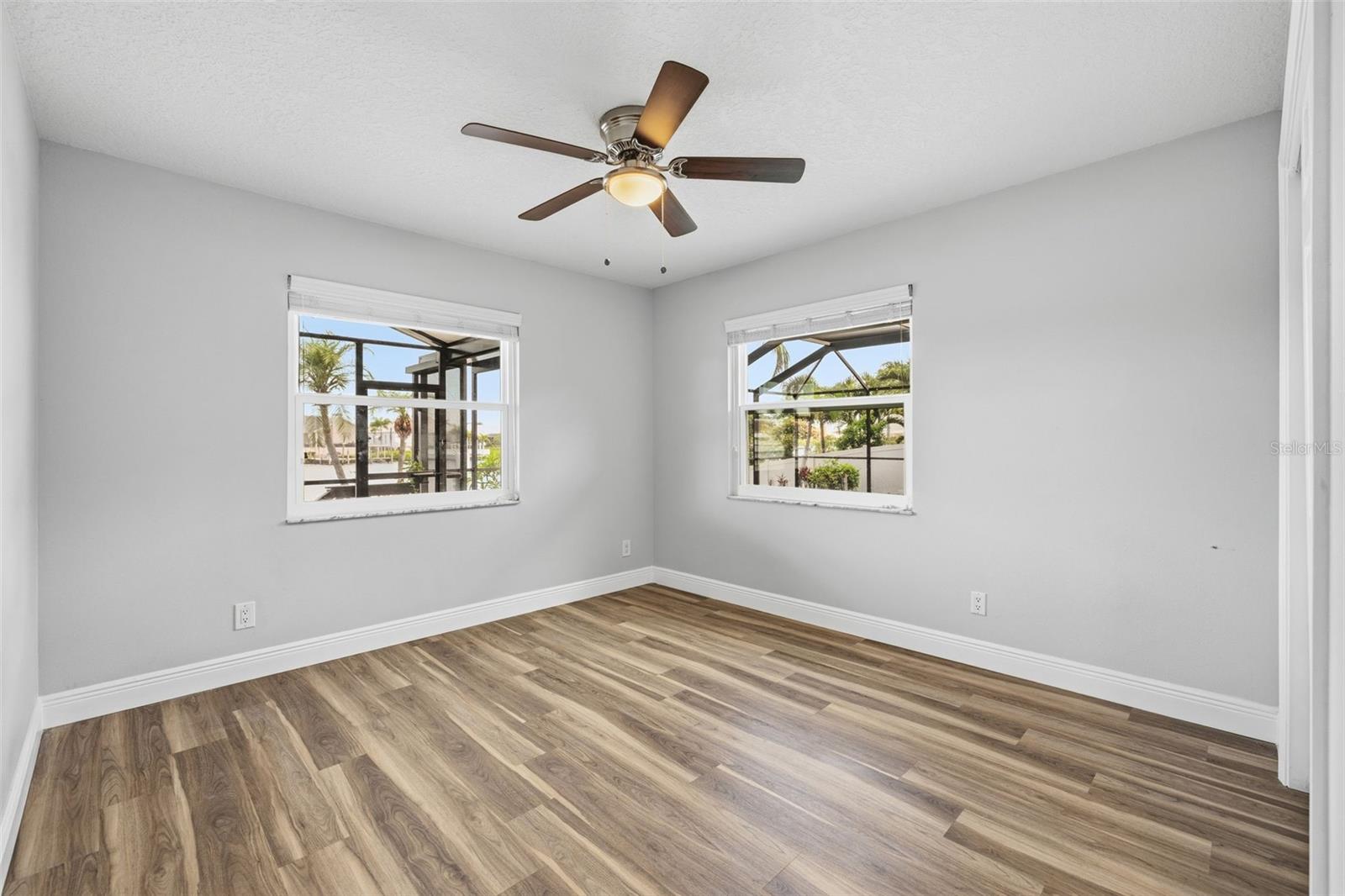 Bedroom 3 overlooks the Water & the Pool! All Newer Energy Efficient Impact Windows!