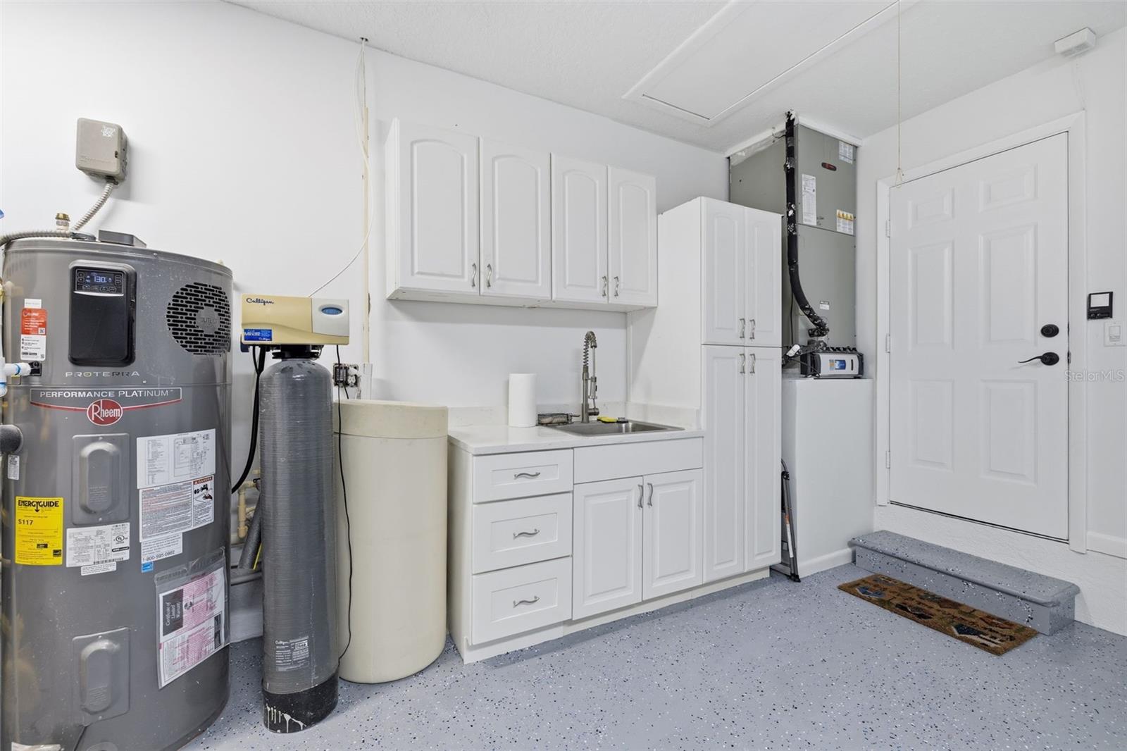 Hybrid Hot Water Heater that is energy efficient and outputs cold AC to the Garage! Culligan Water Softener! Quartz Counters with storage Cabinetry! AC is a TRANE with a Clean Effects Filter!