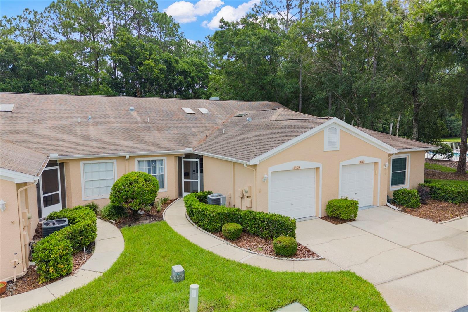Sprawling lawn with walk way to unit