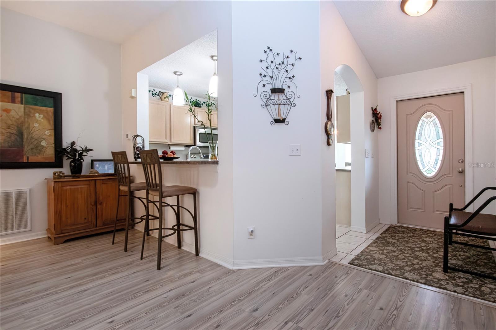 Entrance into home with kitchen to the right.