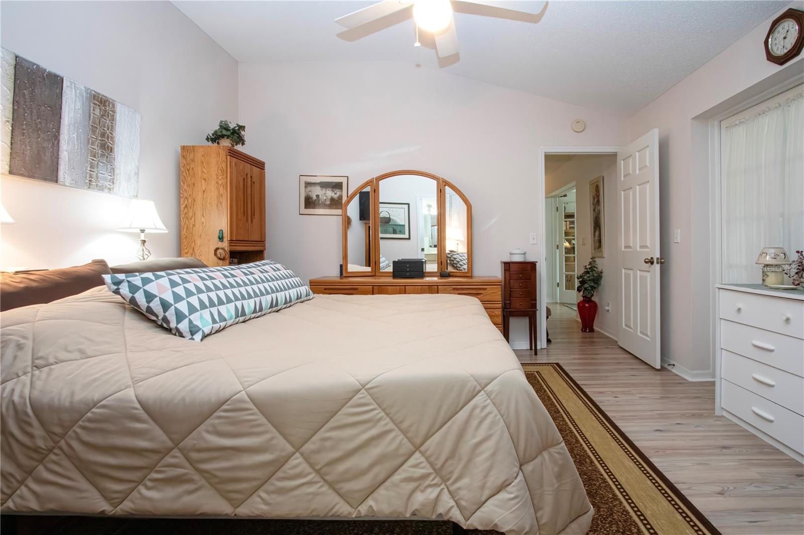 Primary Bedroom- curtained French Door for easy access to Florida Room