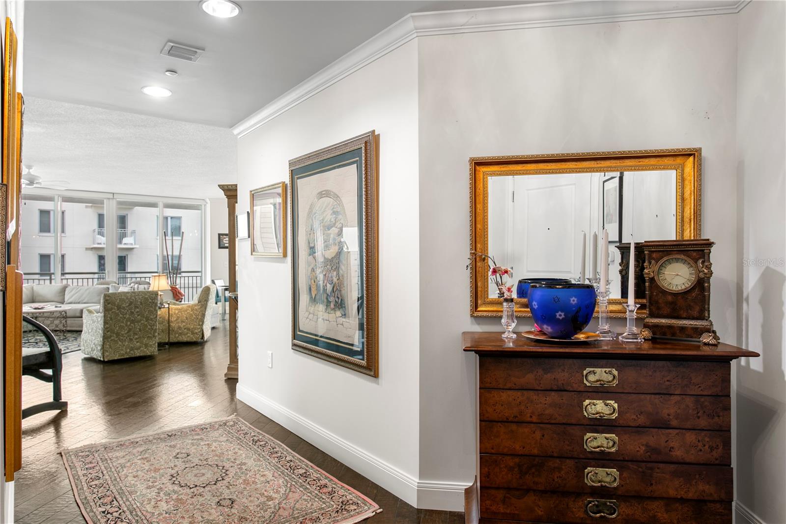 The welcoming entry foyer offers ample wall space to showcase cherished family photos, artwork, or travel mementos, allowing you to personalize the space and make it your own