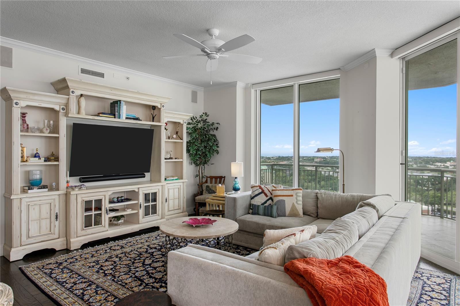 This light-filled residence where floor-to-ceiling windows showcase sweeping views of Harbour Island, Hillsborough Bay and glimpses of Tampa’s skyline and Benchmark Arena