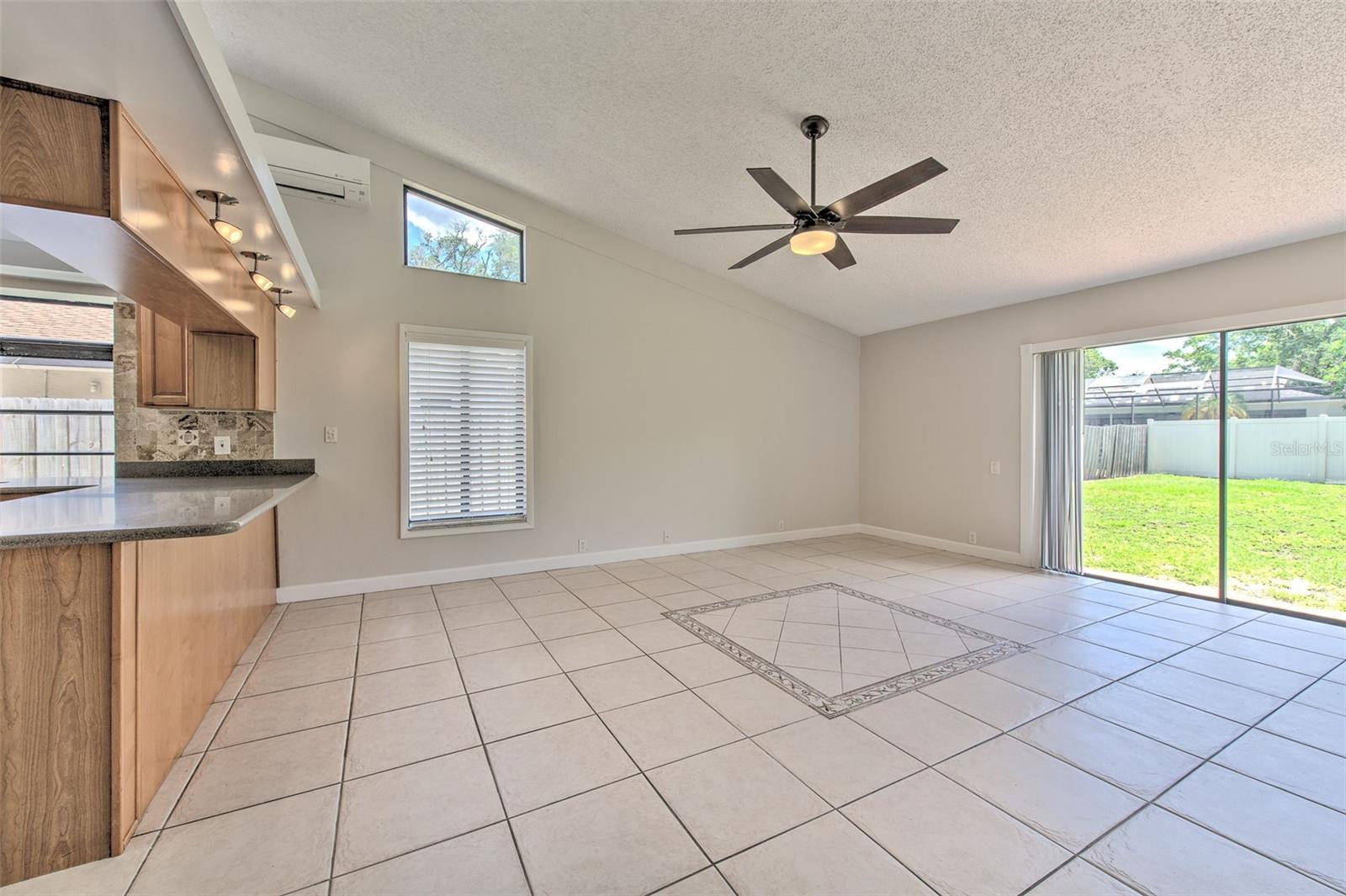 Family Room adjacent to Kitchen w/ access to backyard and patio