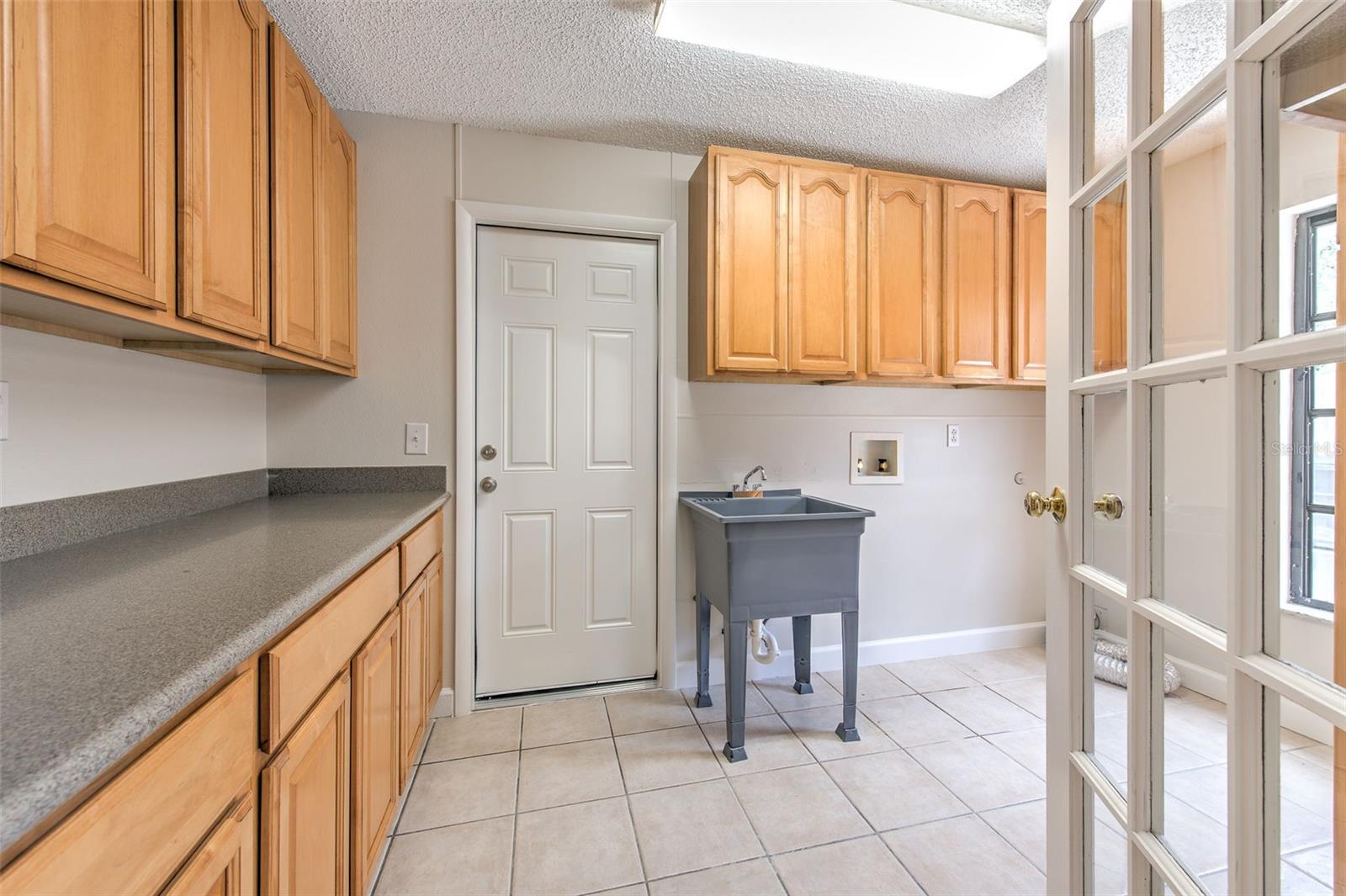 Large Inside Laundry Room between garage & kitchen