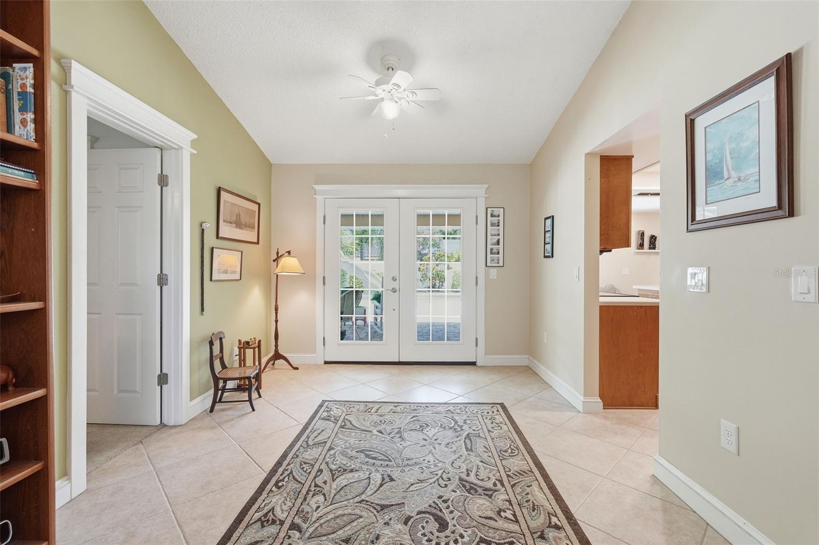 French doors to patio and pool area