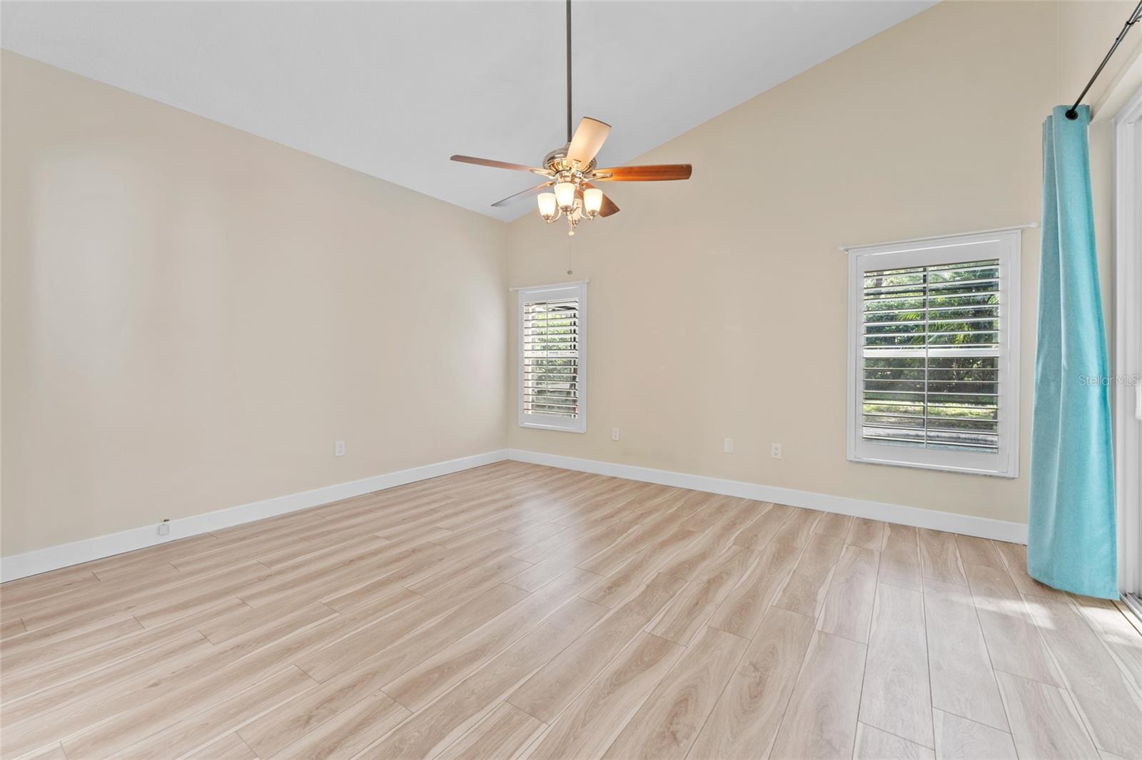 Master suite open sliding glass doors to pool.
