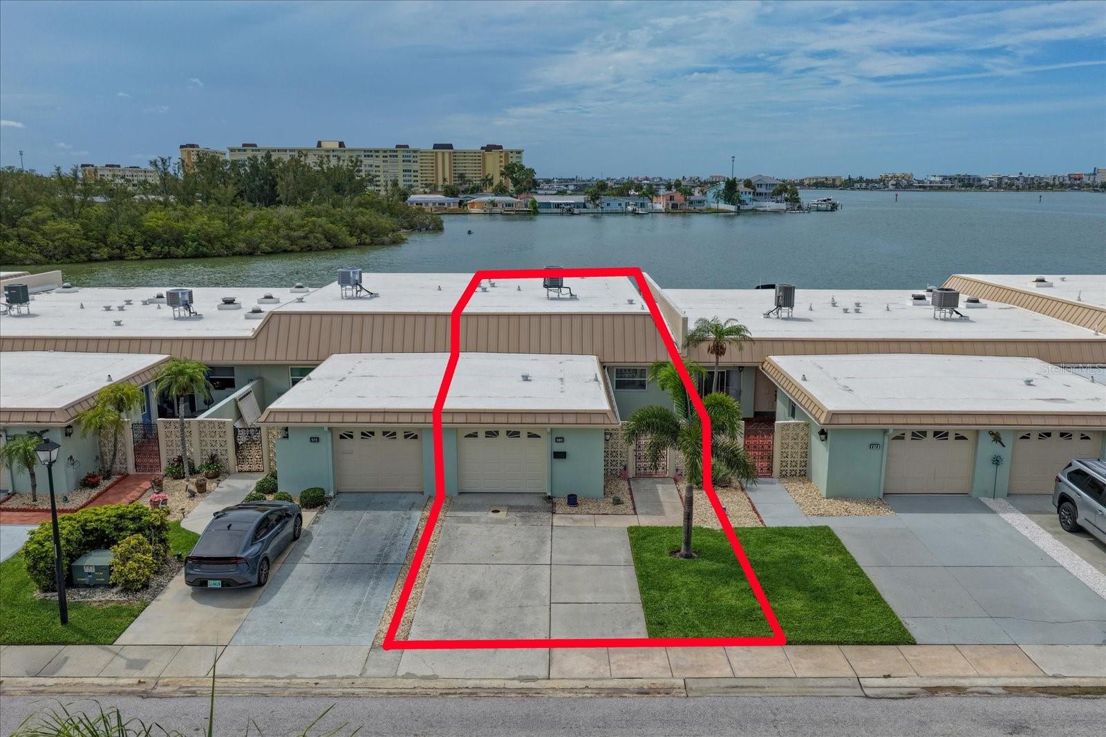 Spacious two-car driveway, one-car garage, and a newly installed air conditioning system.
