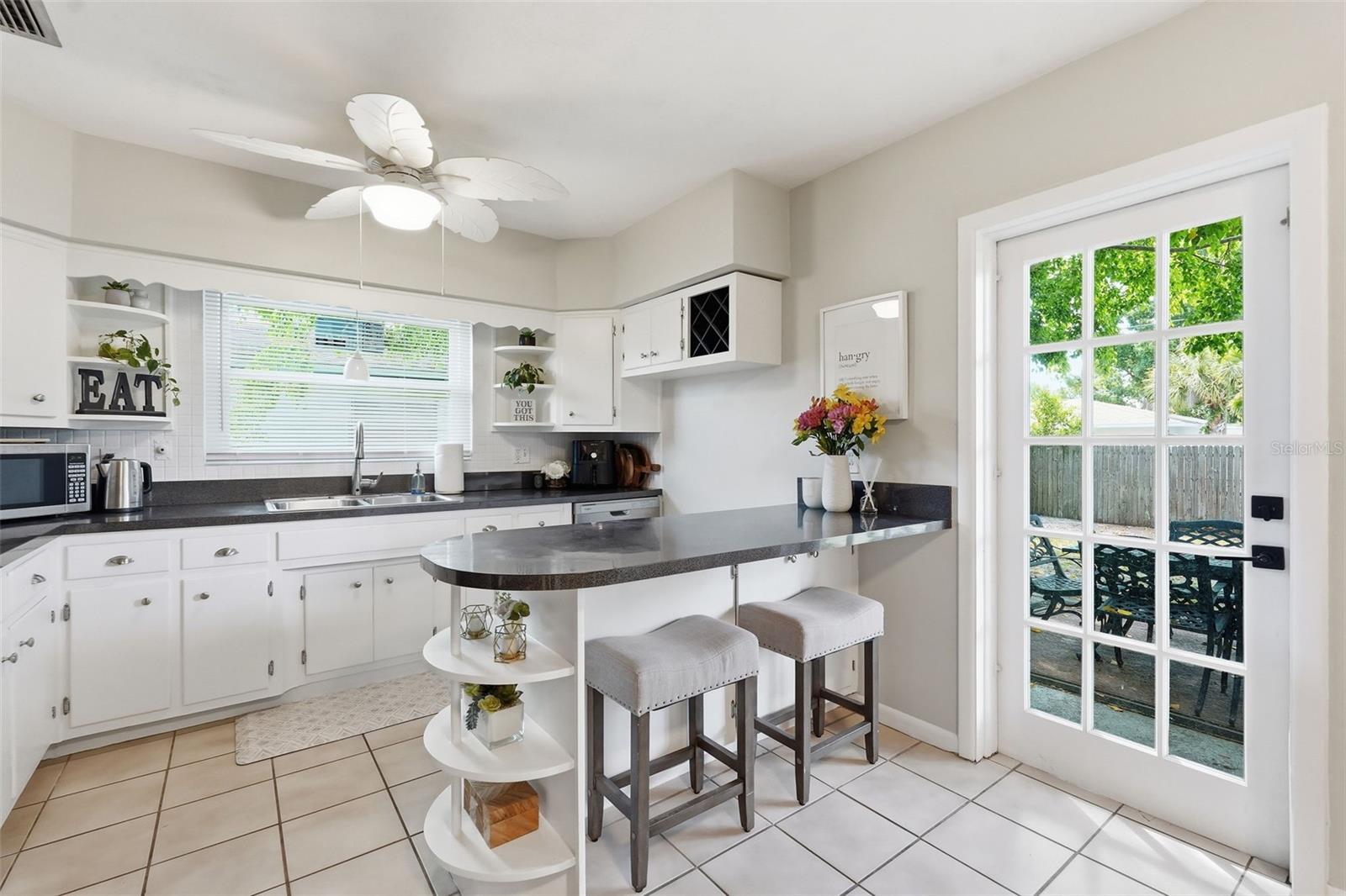 Bright and cheerful kitchen, door to backyard