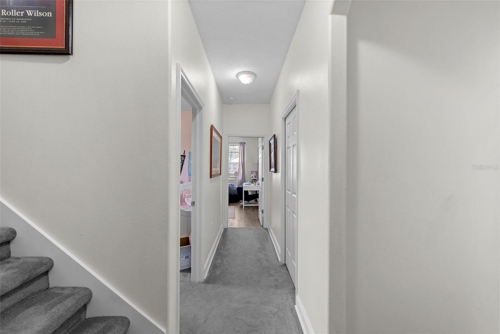 Hallway view connecting bedrooms and living spaces.