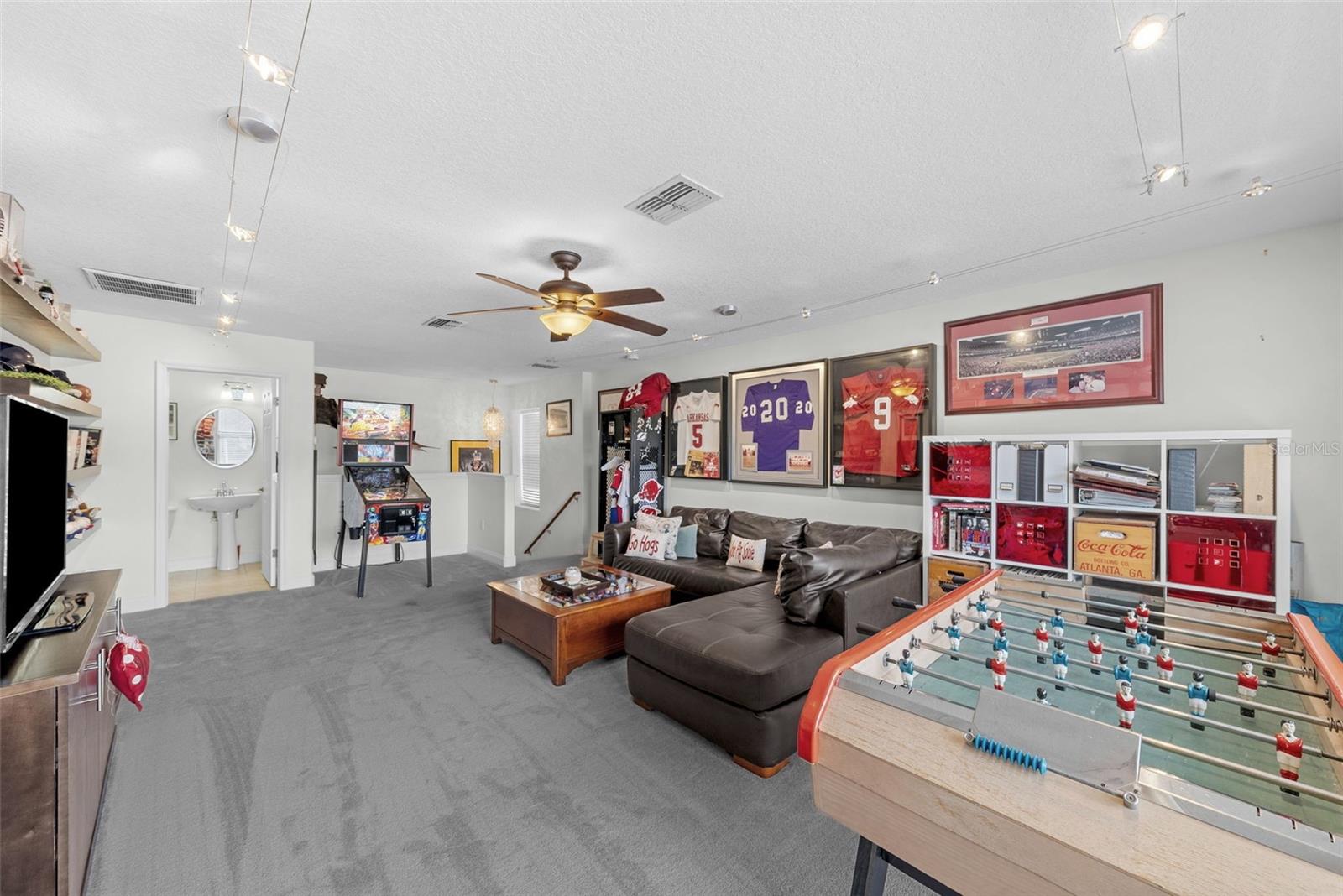 Upstairs bonus room with space for entertaining and hobbies.