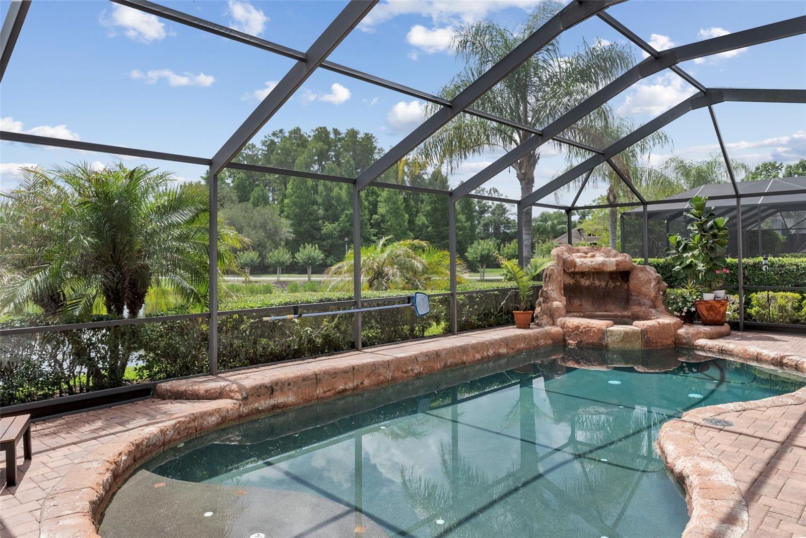 Custom pool and spa with rock waterfall feature.