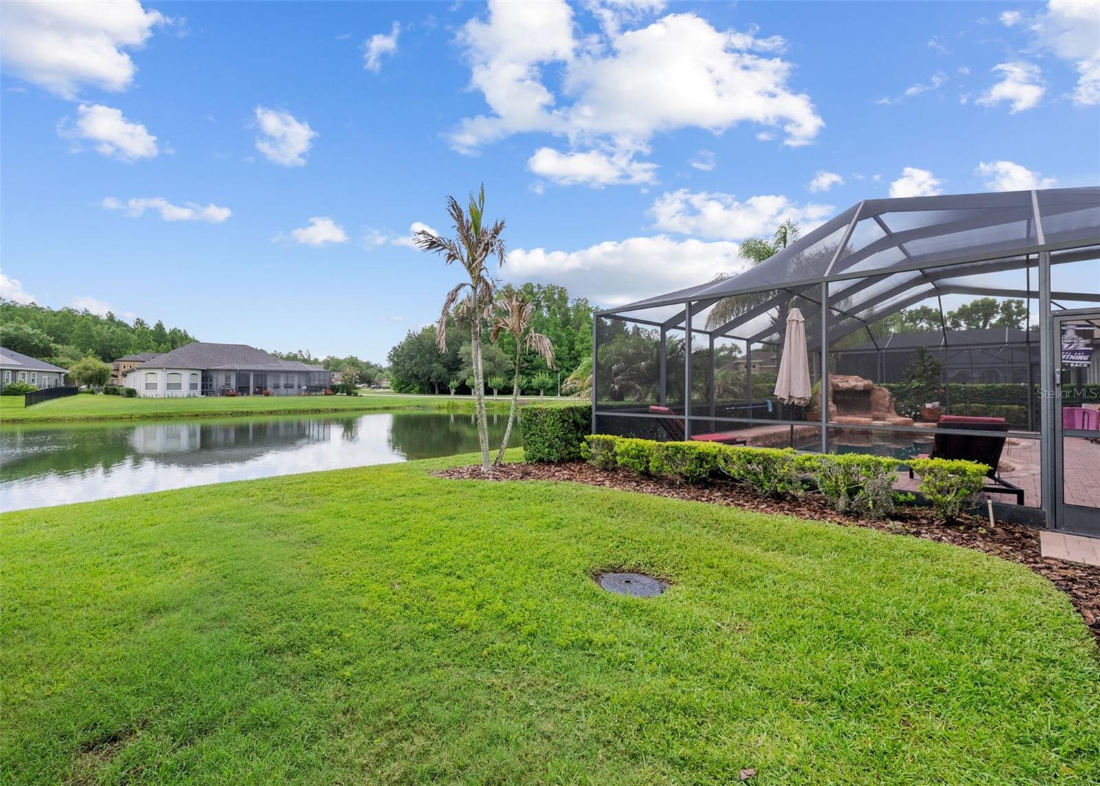 Backyard pond views create a peaceful private setting.