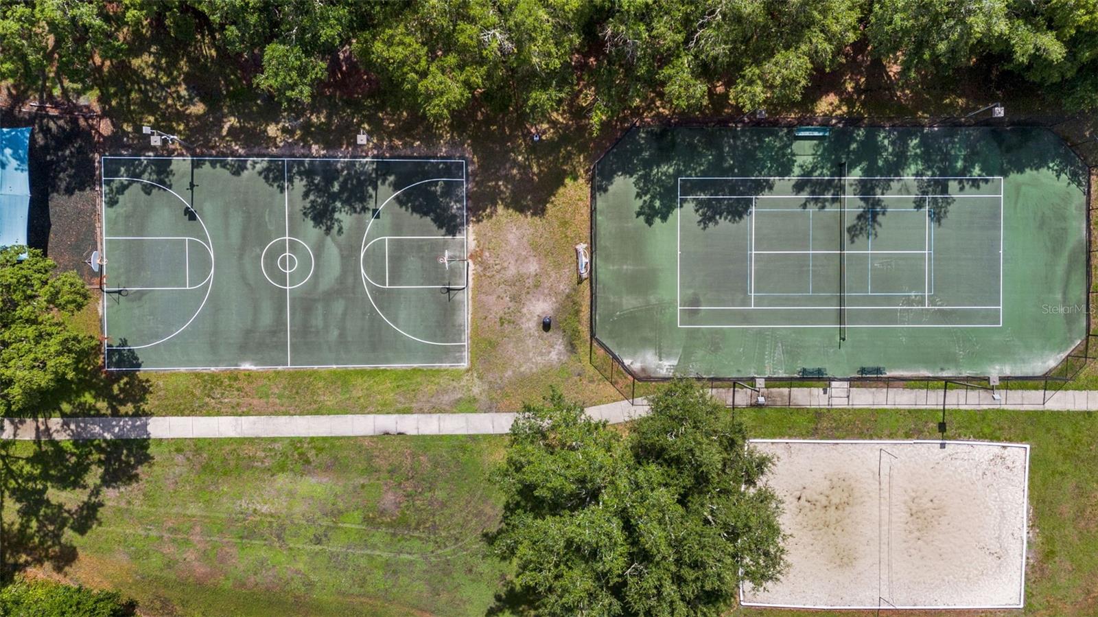 Community basketball and tennis courts from above.