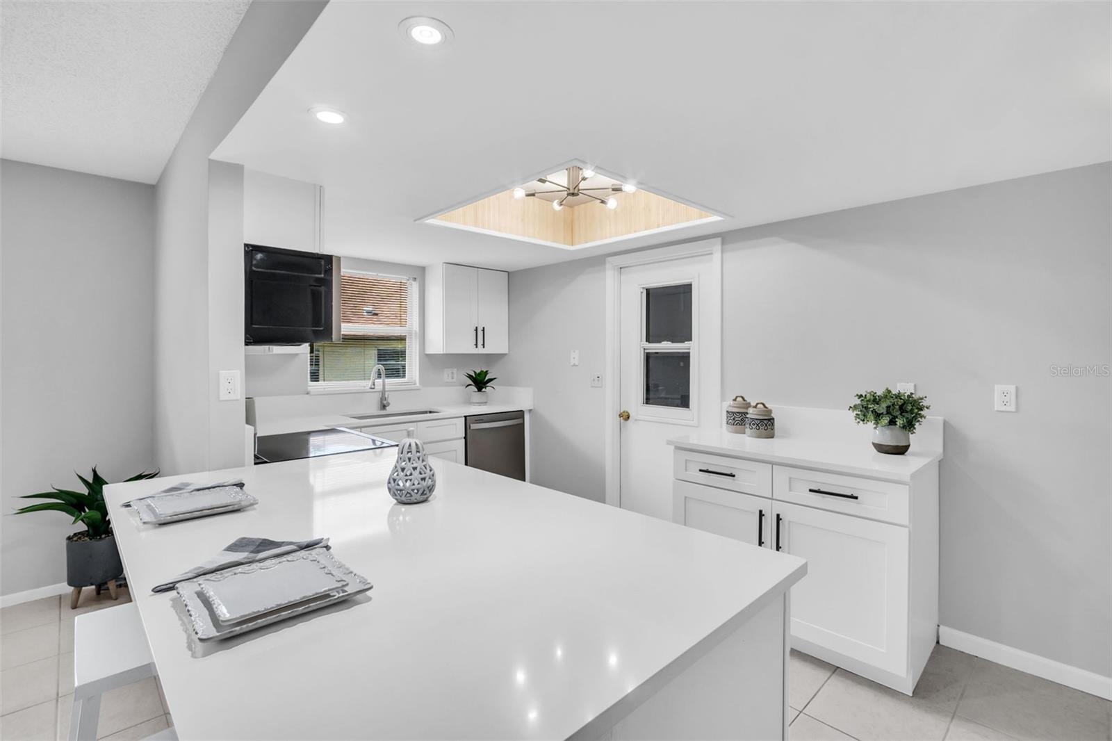 Island seating for casual dining and convenient garage access~